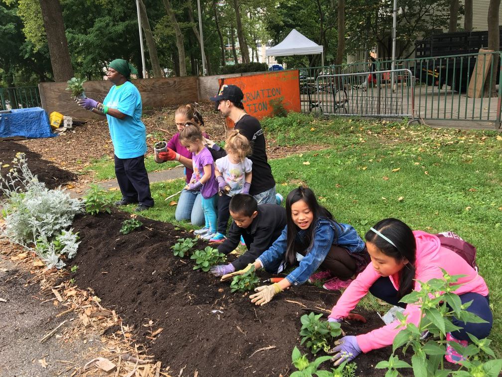 Kids planting the trees in RI Living Library & Think Park on Roosevelt Island Day, June 17, 2017 at Roosevelt Island, NYC